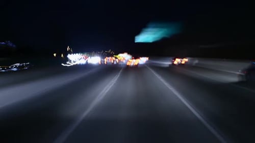 Abstract Nighttime Freeway Drive with Streaking Lights