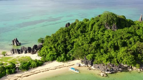 Tropical Island with a White Beach and Limestone Cliffs, Aerial View. Sabitang Laya