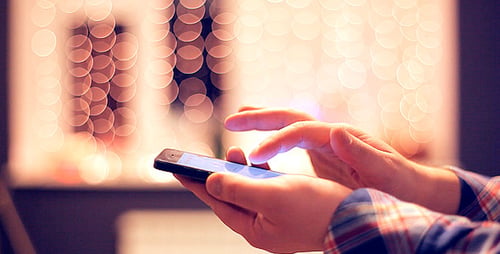 Man Working on the Touchscreen Mobile Phone