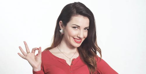 Woman Giving OK Sign on White Background