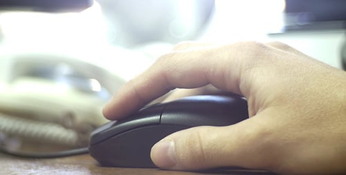Close Up of Hand Clicking Computer Mouse at Work