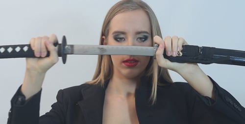 Girl Pulls out a Samurai Sword From its Sheath