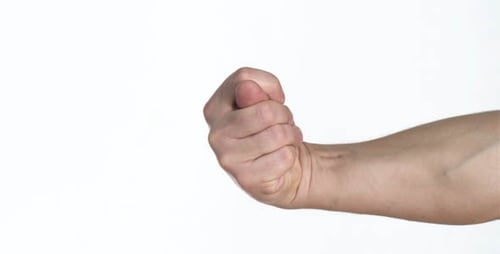 Hand performing the "Mano Fico" gesture