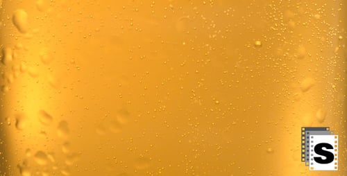 Golden Liquid with Bubbles Close Up