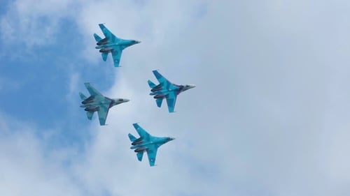 Fighter Jets Perform Aerial Maneuvers in Cloudy Sky