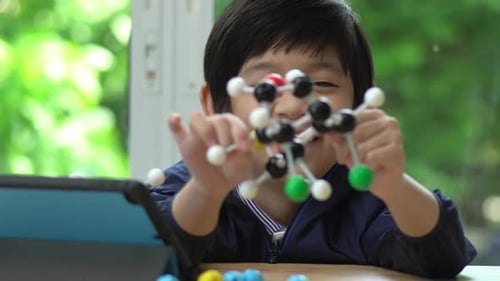 Child Learning Science with Molecule Model at Home