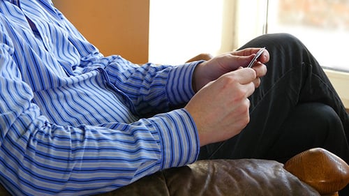 Man Playing Solitaire Card Game Indoors