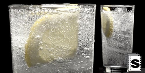 Sparkling Drink with Lemon and Ice being Poured
