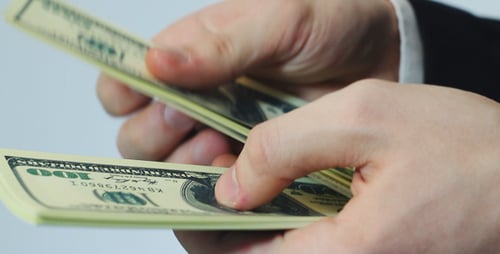 Counting Stack of One Hundred Dollar Bills