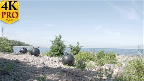 Three Big Sea Mines Found on the Rocky Shore