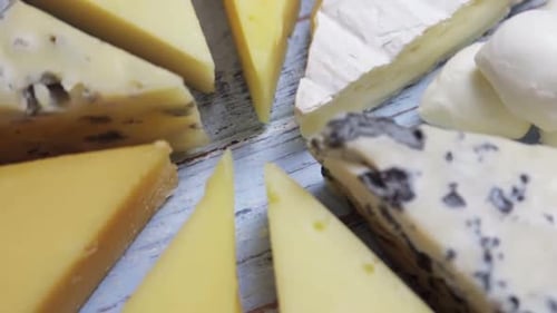 Close Up of Delicious Cheese on Wooden Board