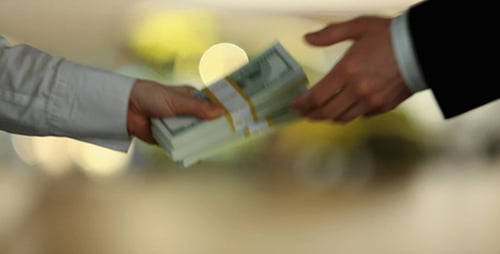 Human Hands With Dollar Bill