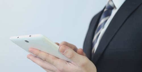 Presentable Businessman Using Tablet