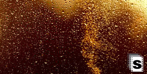 Raindrops on Glass with Golden Light