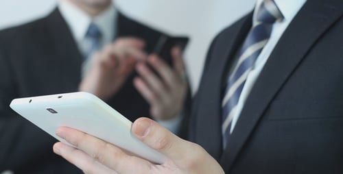 Businessmen Use the Touchpad