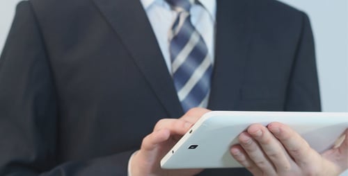 Businessman Uses White Touchpad