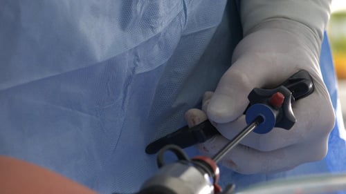 Surgeon Performs Medical Procedure with Surgical Instruments