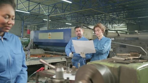 Professional workers teams work in the metalwork manufacturing factory.
