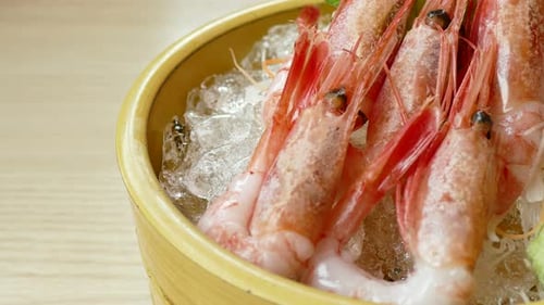 Fresh Raw Shrimp Sashimi on Ice in Bamboo Bowl