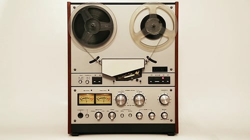 Vintage Reel-to-Reel Tape Recorder in Operation