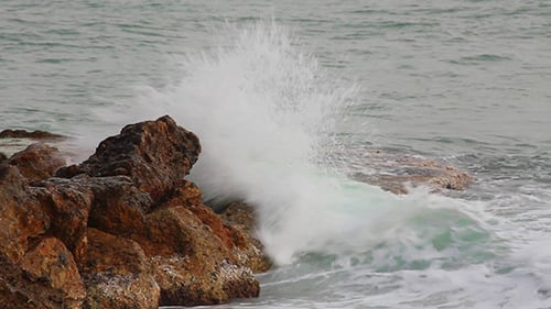Sea Waves Breaking On Rock