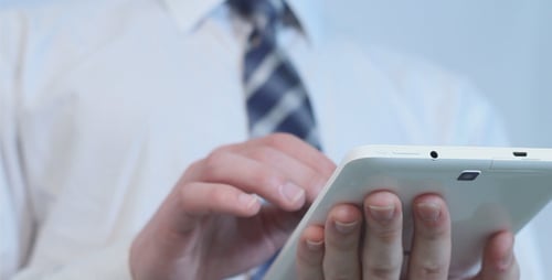 Office Worker Using White Tablet
