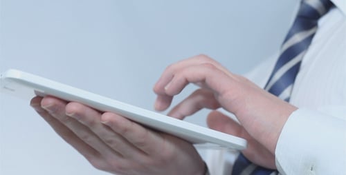Businessman Working on Tablet