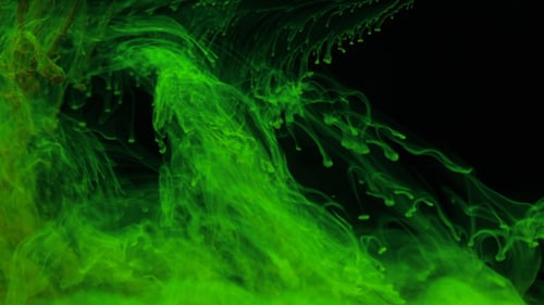 Swirling Green Ink Creating Abstract Space Background
