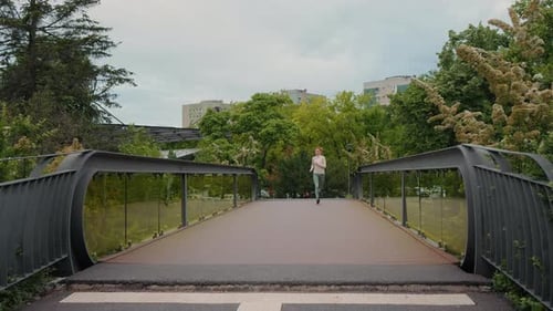 Woman jogging in the park, healthy lifestyle.