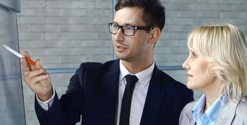 Business Professionals Discussing a Strategy in Modern Office