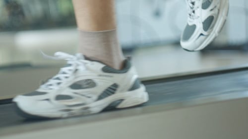 Legs Walking on a Treadmill for Exercise
