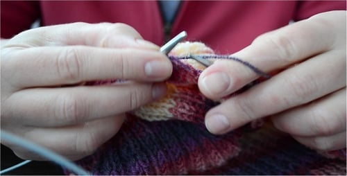 Woman Knitting with Wool and Knitting Needles