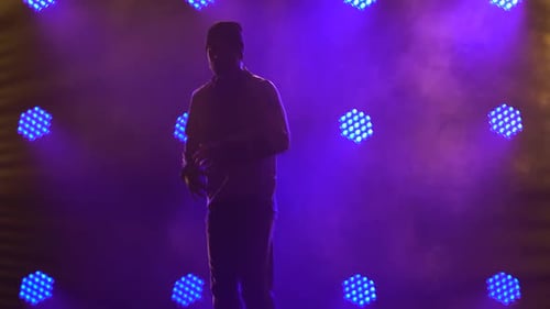 Silhouette of a Male Dancer Dancing Break Dance, Hip Hop, Street Dancing in the Studio, Isolated