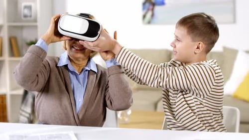 Child Helps Woman Use Virtual Reality Headset