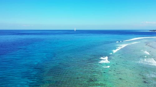 Wide birds eye abstract view of a paradise sunny white sand beach and blue water background