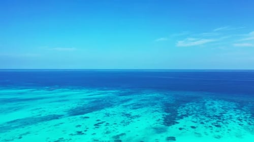 Aerial flying over landscape of beautiful coast beach break by shallow water and white sandy backgro