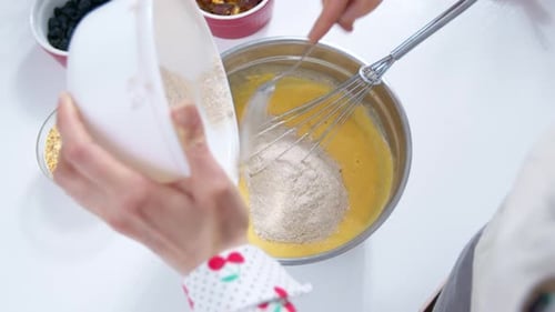 Adding Flour to Yellow Batter and Mixing Ingredients