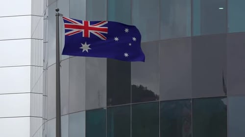 Realistic Australian Flag Waving on Modern Building