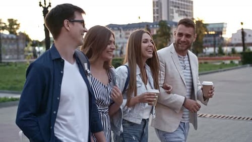 Four Friends Walking and Talking in the City