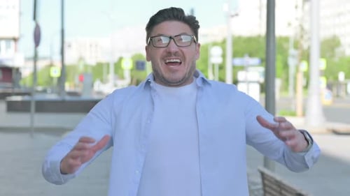 Man Yelling Loudly on a City Street