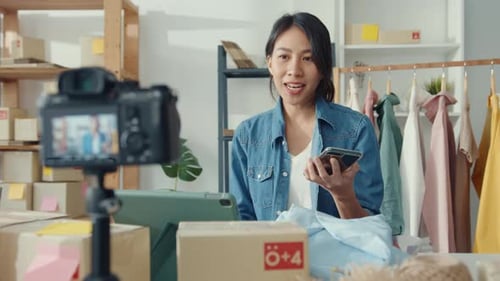 Woman Vlogging About Her Online Business and Shipping