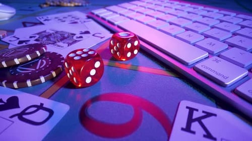 Gaming Table with Computer Keyboard Cards Dice and Casino Chips