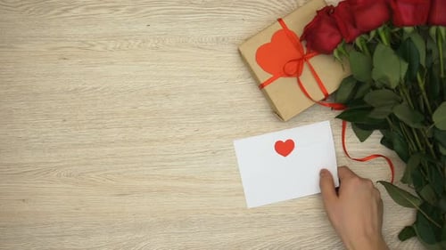 Romantic Gifts and Red Roses on Table