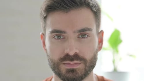 Intense Man Stares Straight Into Camera