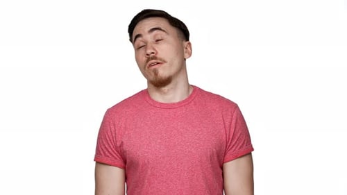 Young Man Rolls Eyes, Confused on White Background