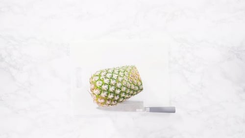 Preparing Pineapple Slice on Cutting Board, Top View