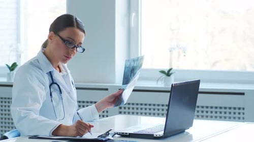 Professional medical doctors working in hospital office making research.