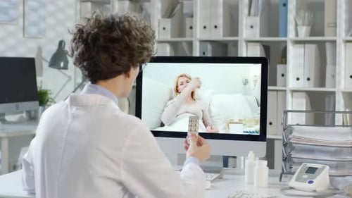 Doctor Consults Patient Online During Telemedicine Appointment