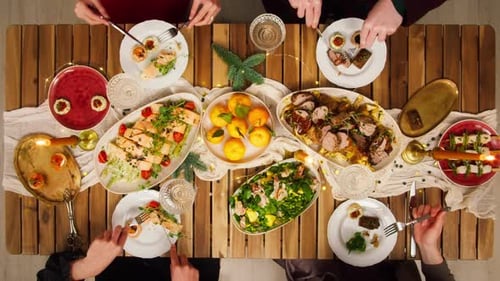 Friends Celebrating New Year Top View Sitting at Dining Table