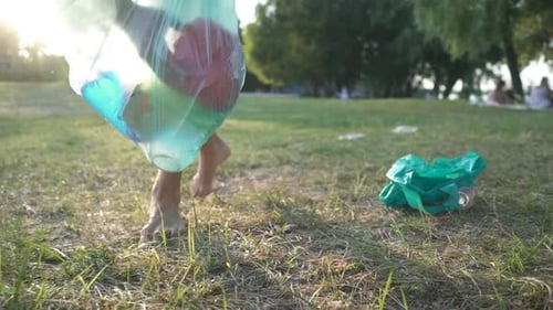 Volunteer Collect Trash in a Trash Bag